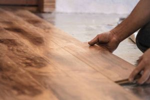 Refinish or replace hardwood floors